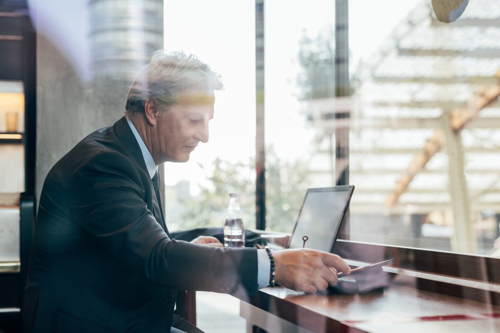 Middle age businessman using computer